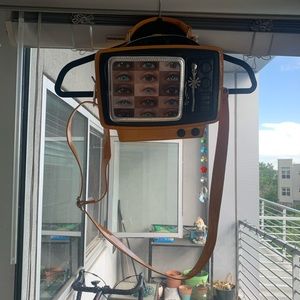 Delia’s moving eyeball tv purse